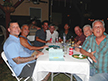 Gordon & Steve C, Steve R & Ron, Johnny & Bob, Joe & Marty having dinner.