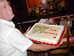 Ron holding the 25 Year Anniversay Cake