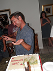 Steve cutting the cake.