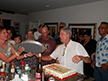 Kim handing Ron a platter our friends Norma & Vivian had engraved for Ron & Steve many years ago.