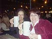 Vivian and Norma holding steins of beer