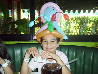 Johnny with baloons on hes head at Senor Frogs