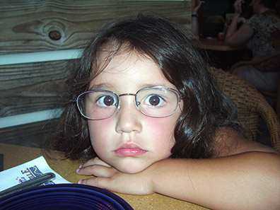 Miranda wearing Daddy's glasses