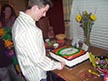 Ron cutting the cake